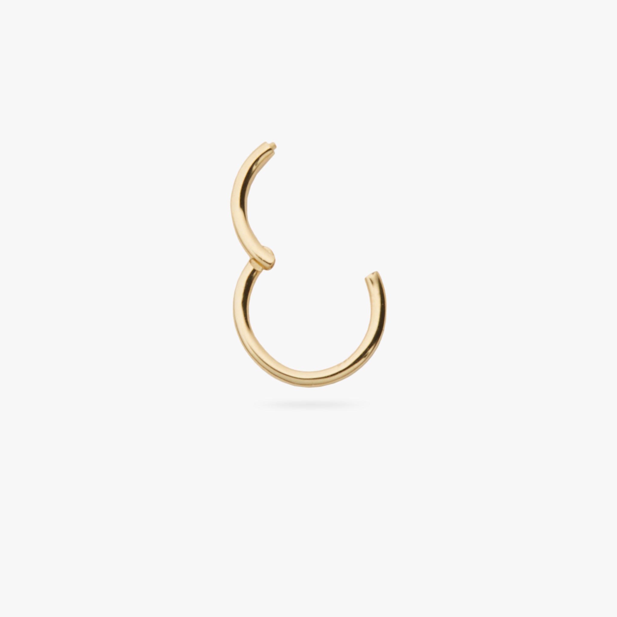 This is a gold clicker earring color:null|gold