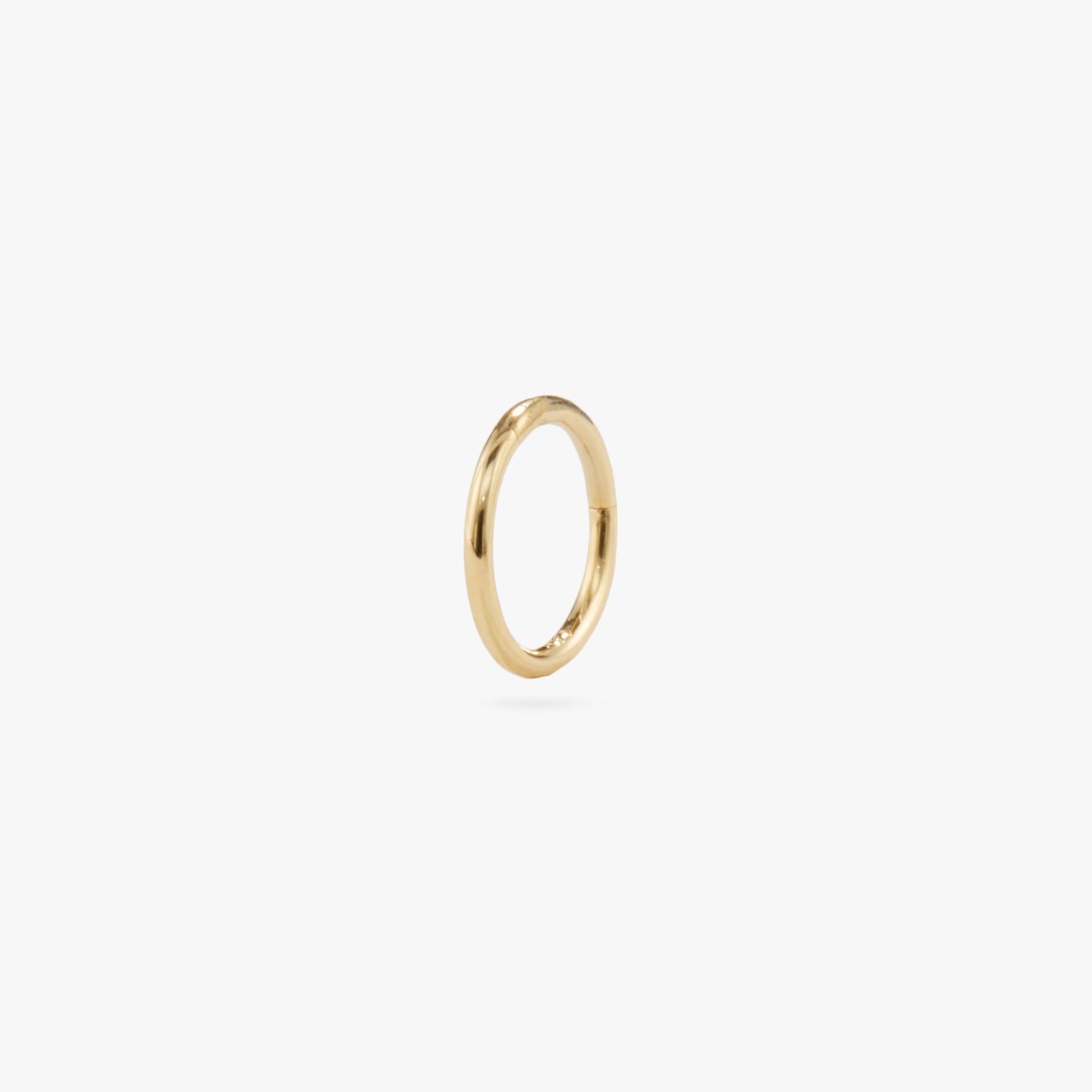 This is a gold clicker earring color:null|gold