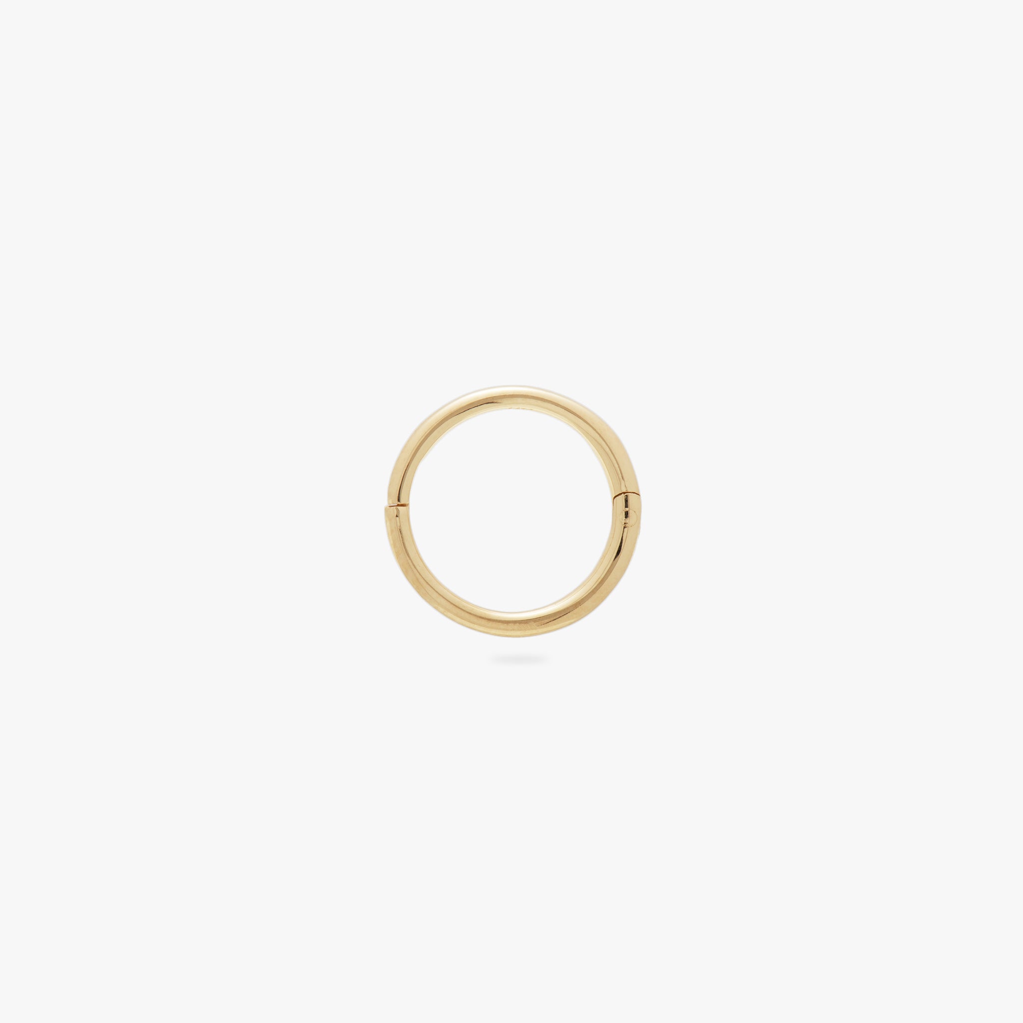 This is a gold clicker earring color:null|gold