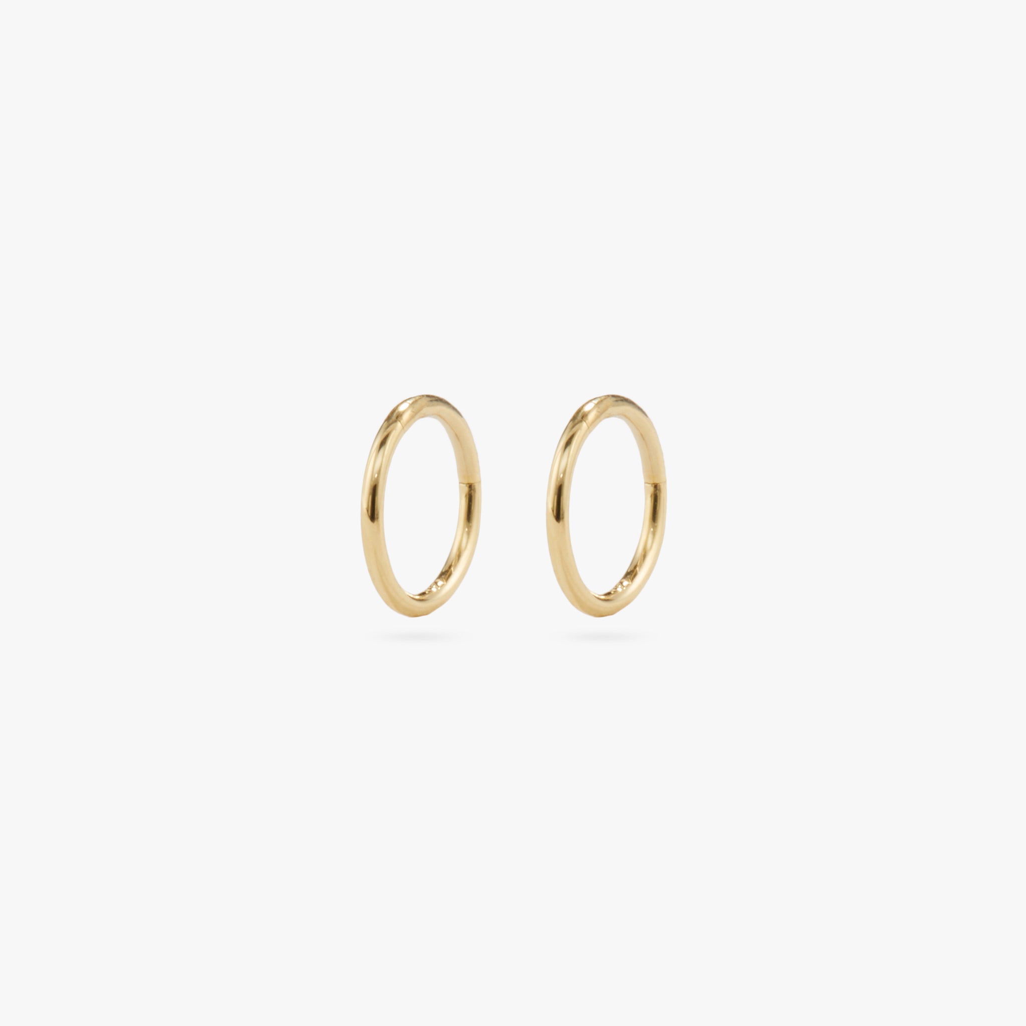 This is a gold clicker earring [pair] color:null|gold