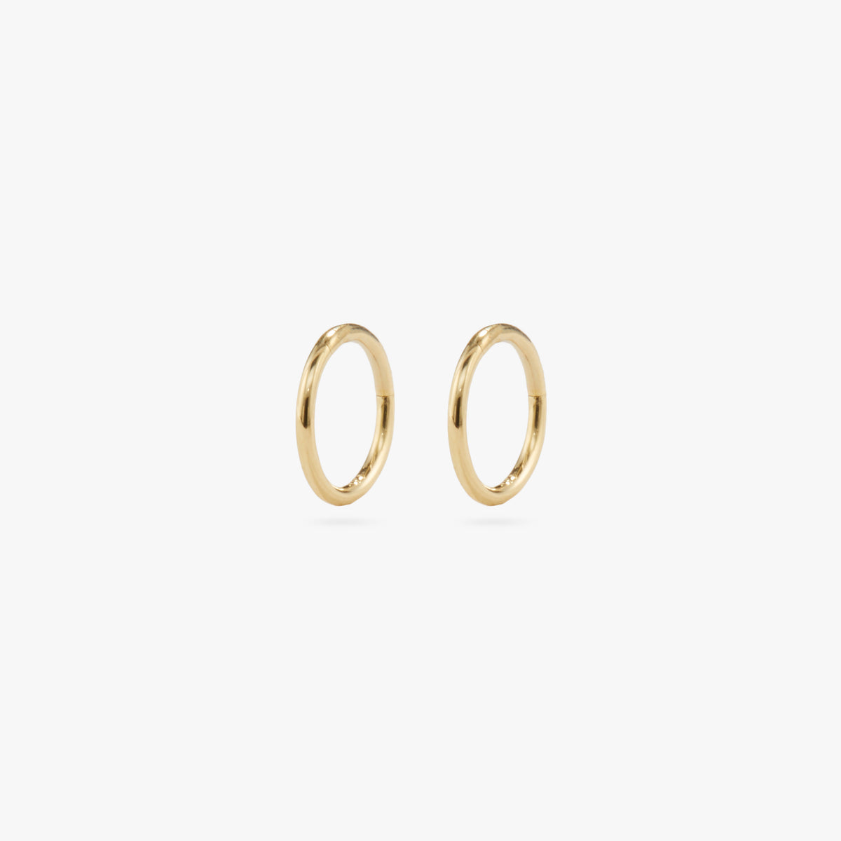 This is a gold clicker earring [pair] color:null|gold
