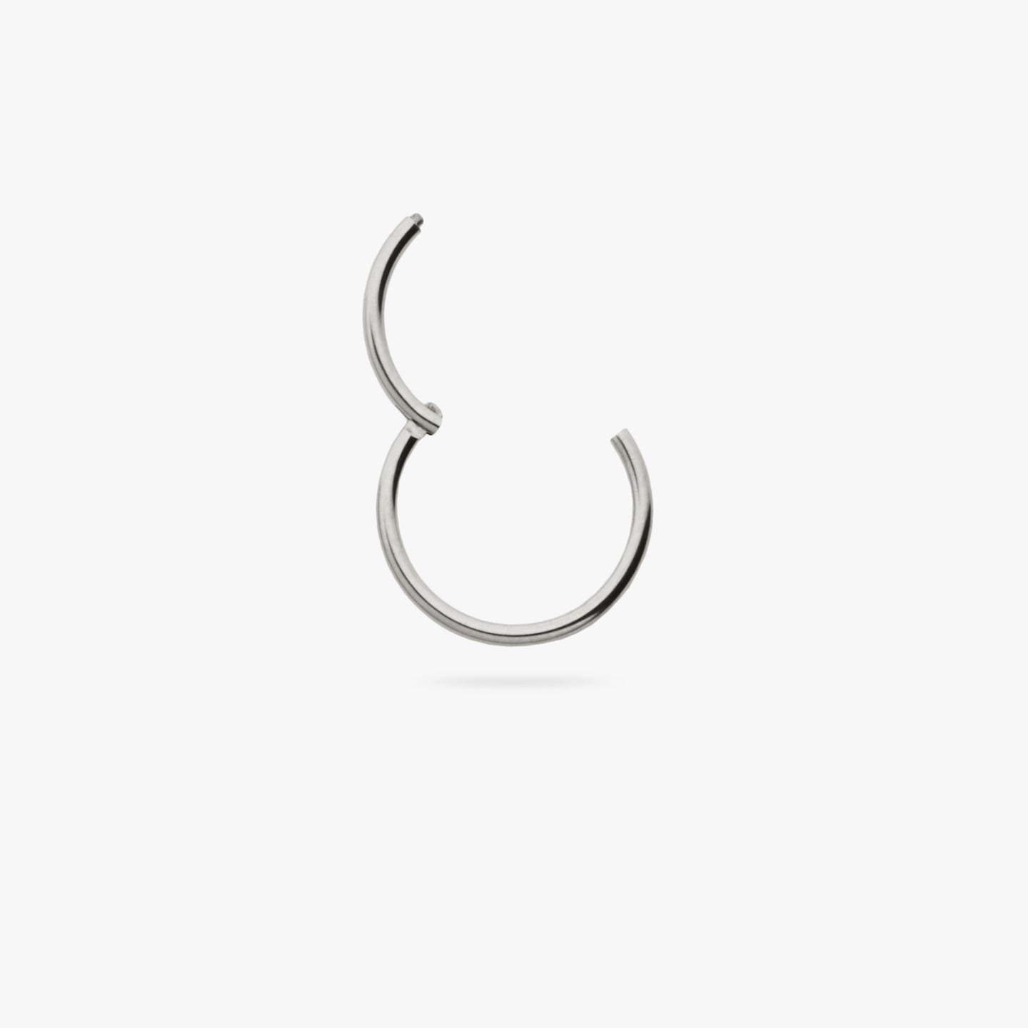 This is a silver clicker earring color:null|silver