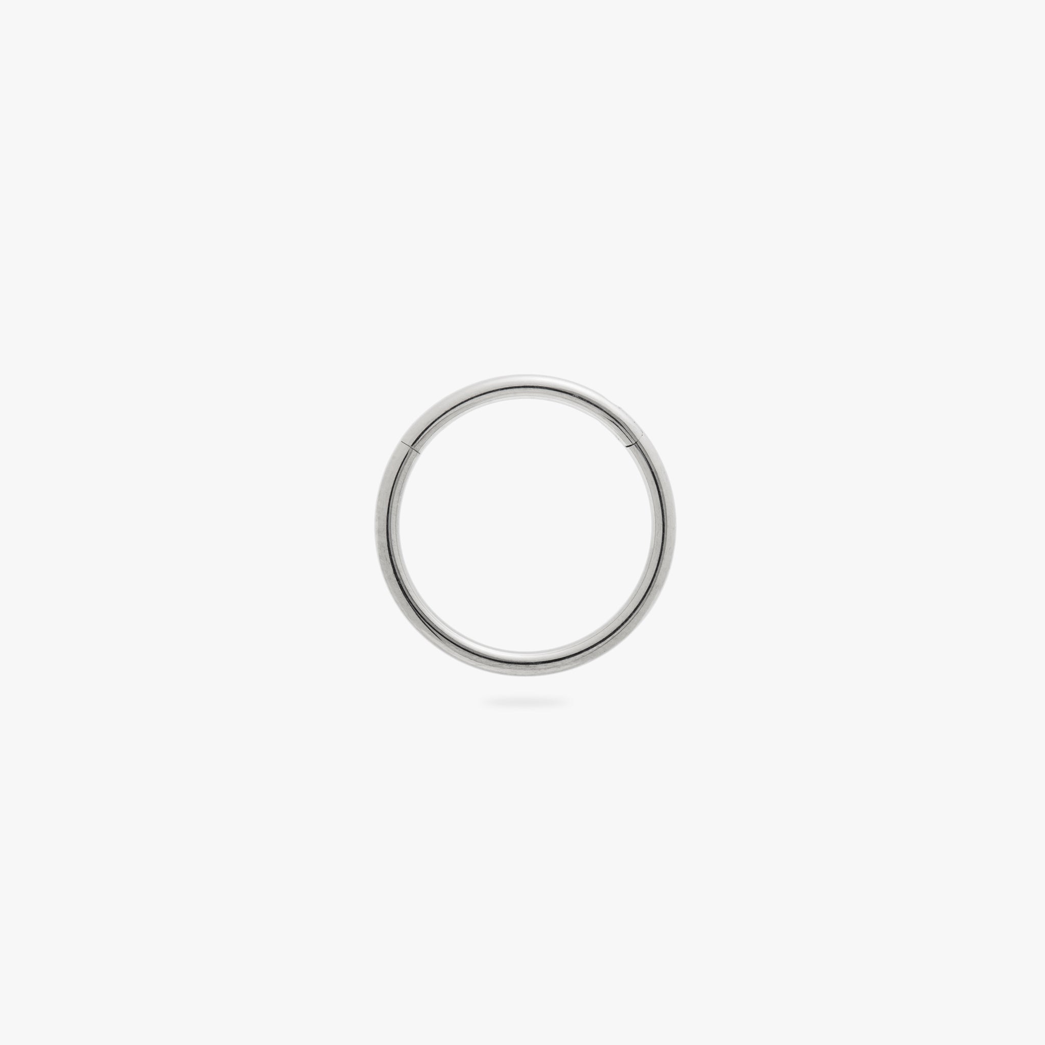 This is a silver clicker earring color:null|silver