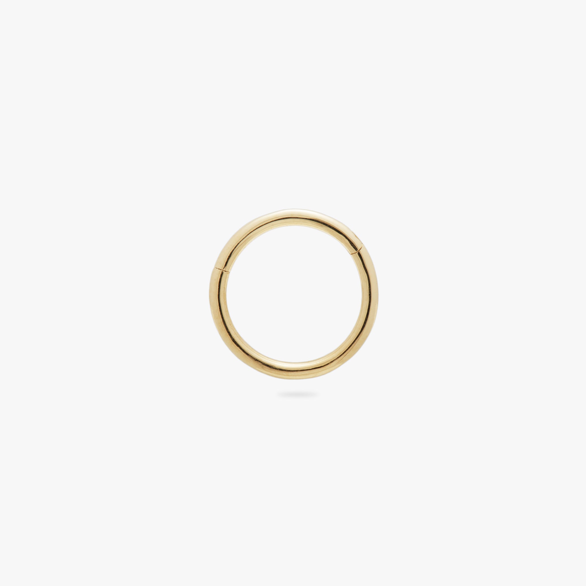 This is a gold clicker earring color:null|gold