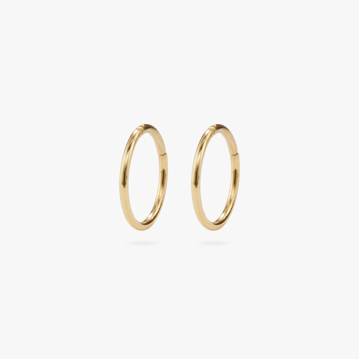 This is a gold clicker earring [pair] color:null|gold