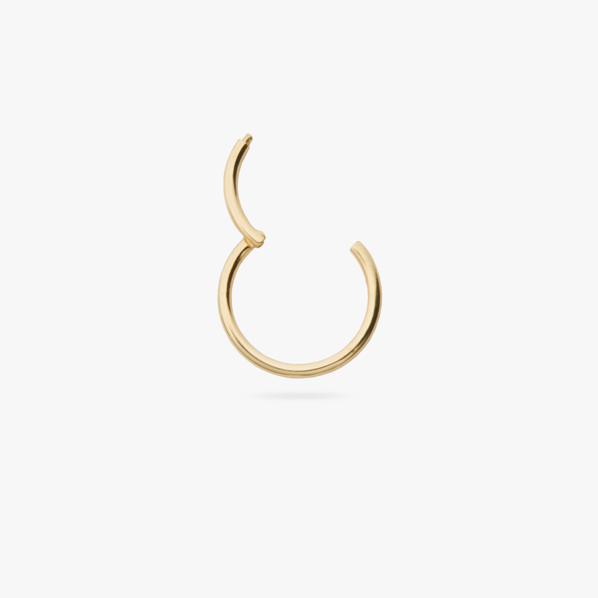 This is a gold clicker earring color:null|gold