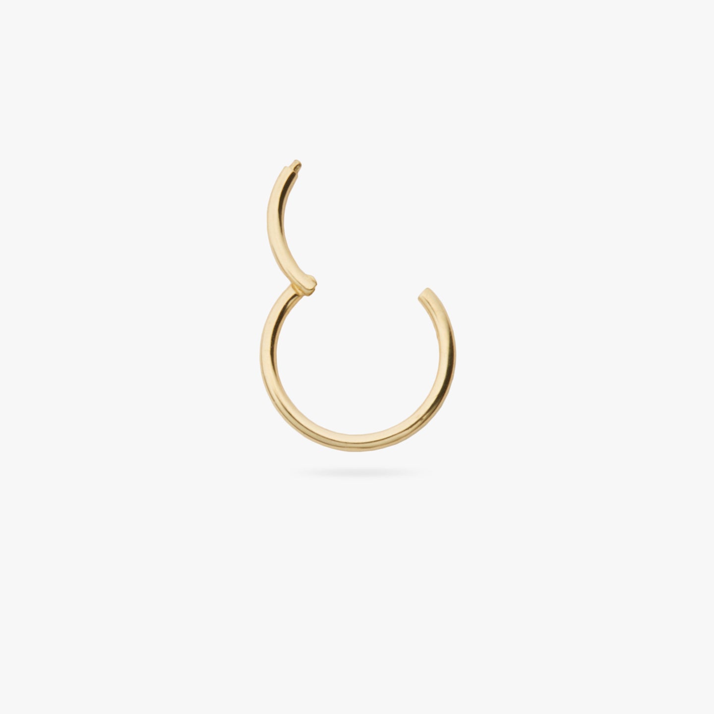 This is a gold clicker earring color:null|gold