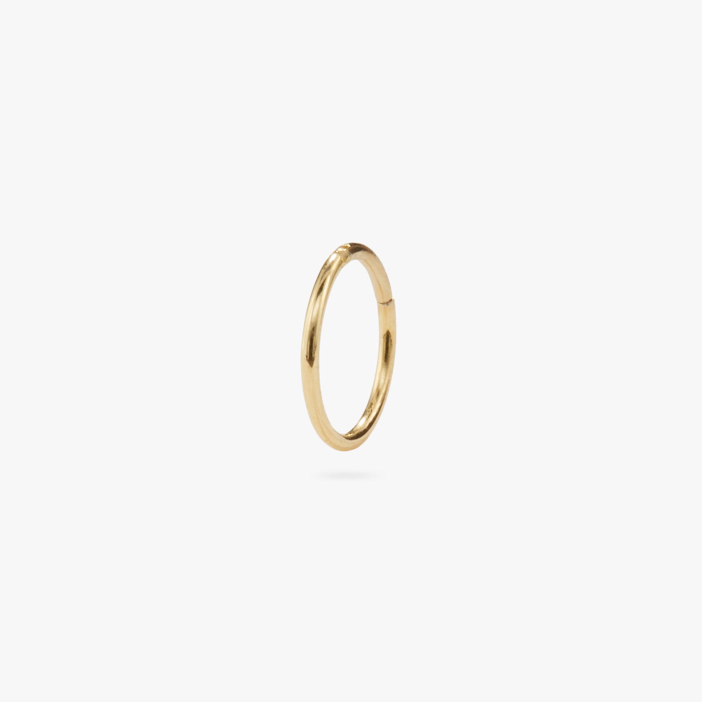 This is a silver clicker earring color:null|gold