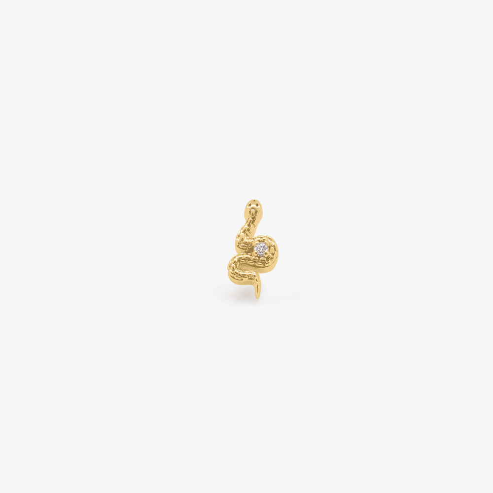 This is a small gold stud that looks like a snake with a cz accent color:null|gold