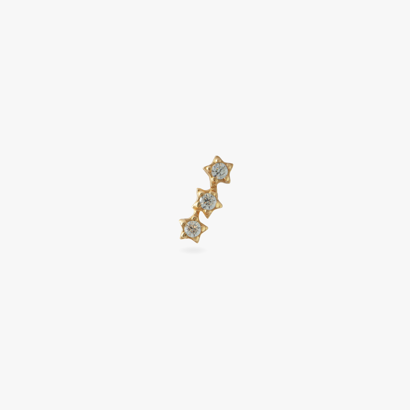 This is a 14k gold stud with 3 CZ's in a star shape color:null|gold/clear