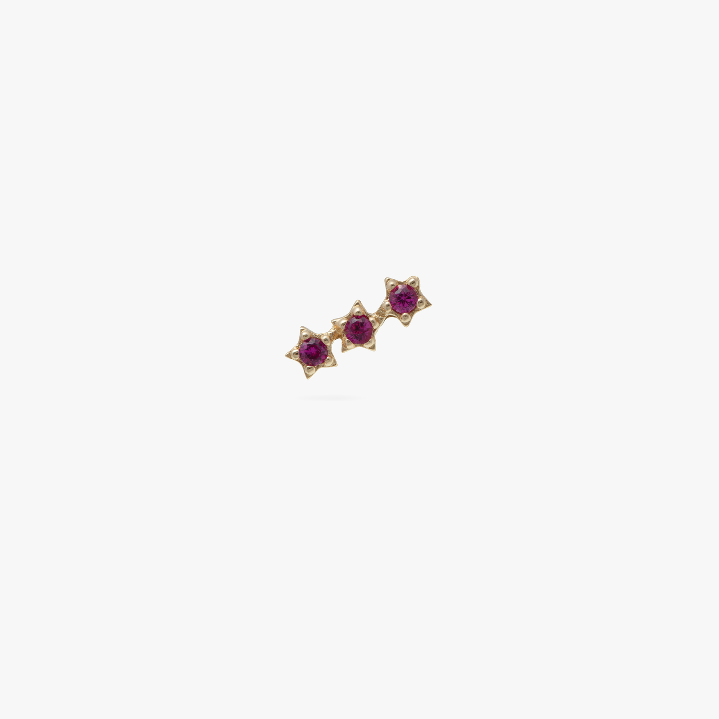 This is a 14k gold stud with 3 pink CZ's in a star shape color:null|gold/pink