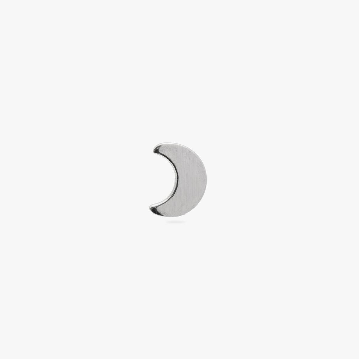 This image is a silver toned titanium crescent moon shaped flatback stud on a white background. 