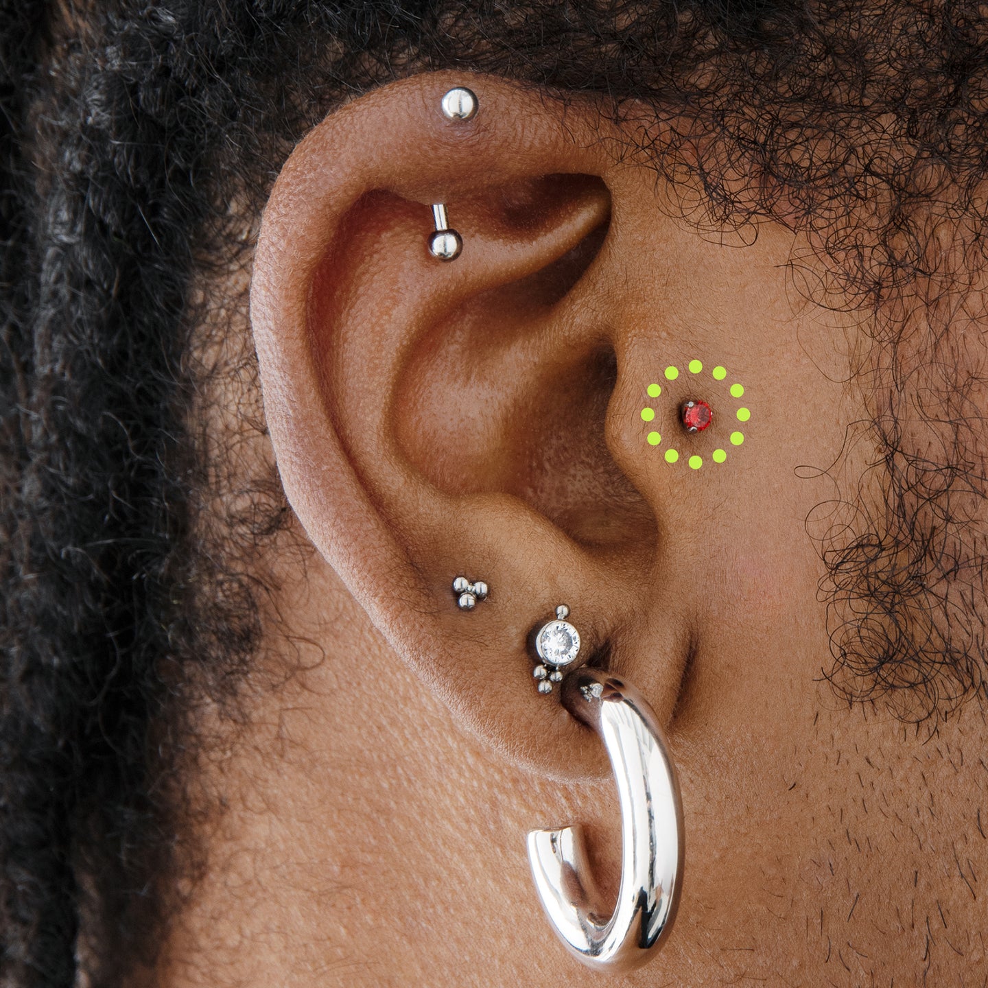 Titanium studs for piercing outlet
