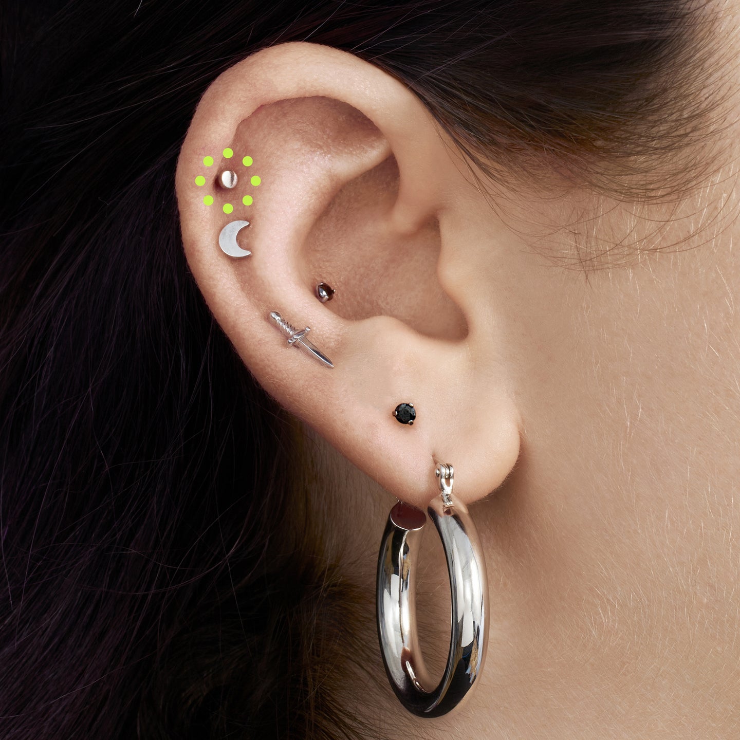 a small stud in the shape of a flat-topped circle made of titanium [hover] color:null|silver