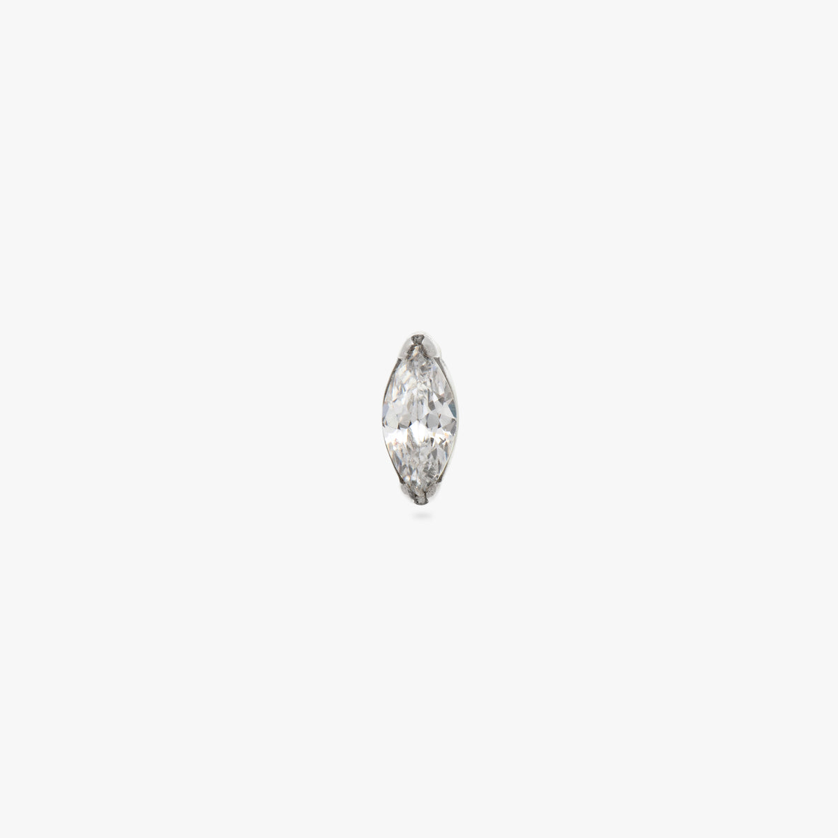 This image is a silver toned titanium flatback stud with a marquise set crystal CZ stone against a white background. - Main view