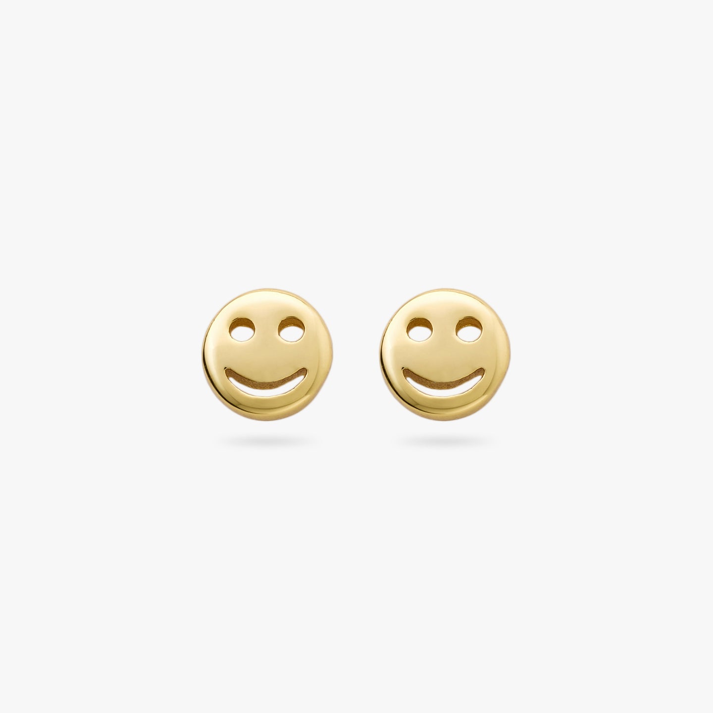 This is a pair of small gold smiley face studs [pair] color:null|gold