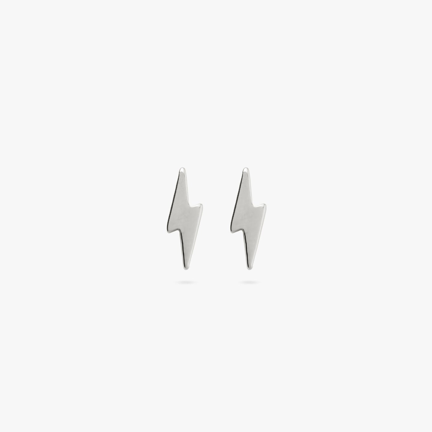 This is a pair of silver lightning bolt studs [pair] color:null|silver