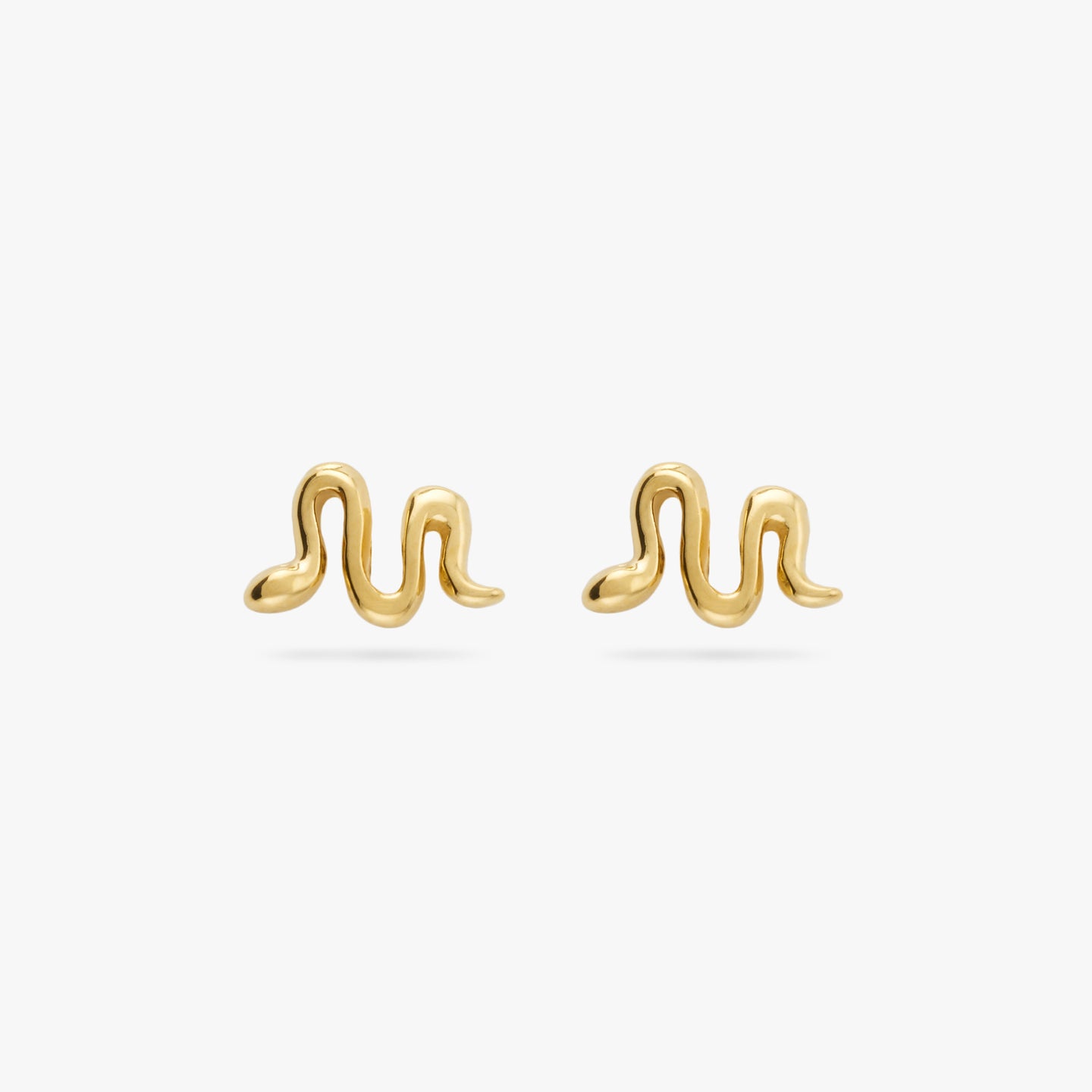 This is a pair of small gold studs in the shape of a snakes [pair] color:null|gold