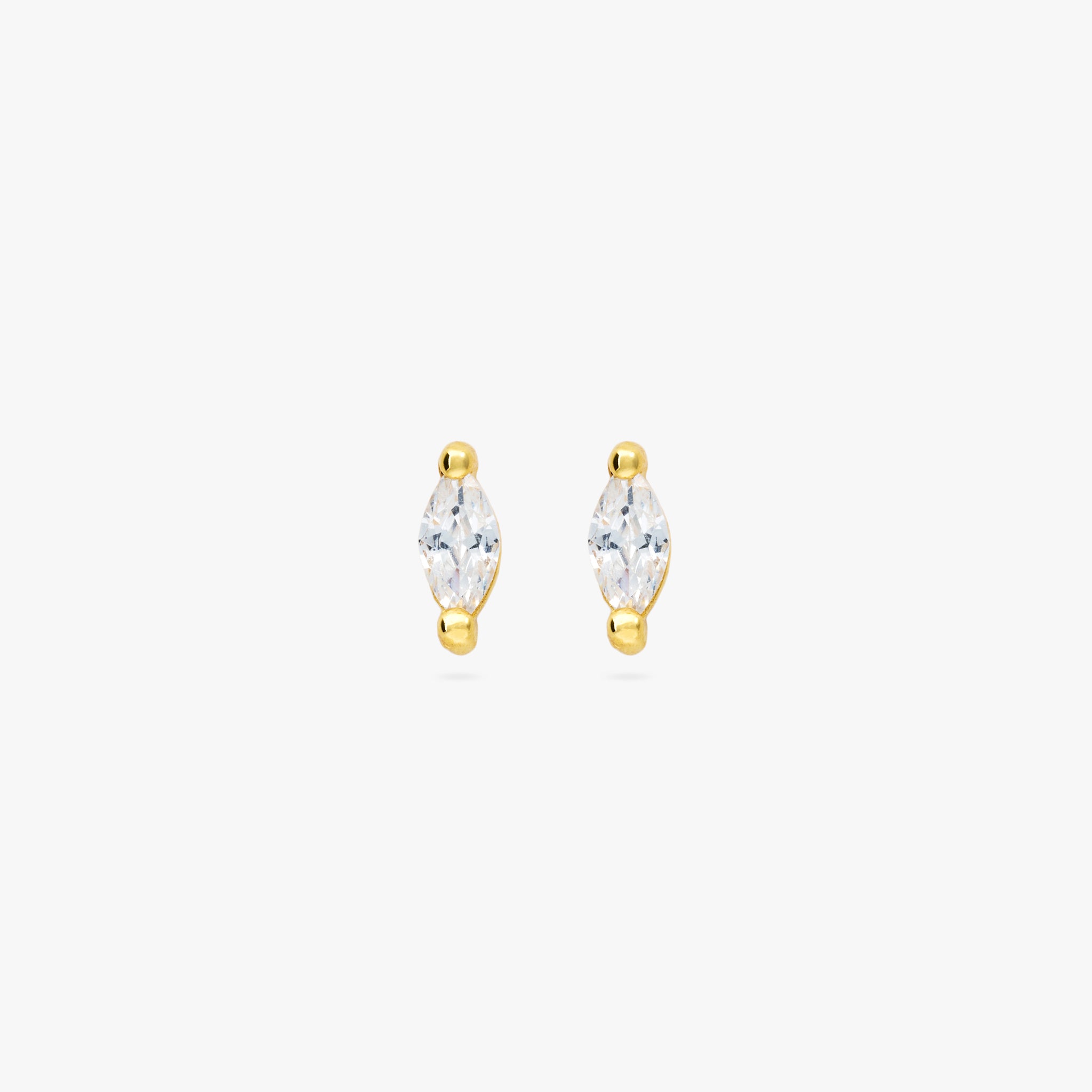 This is a pair of marquise mini studs featuring clear oblong shaped gems and has gold accents. [pair] color:null|gold/clear