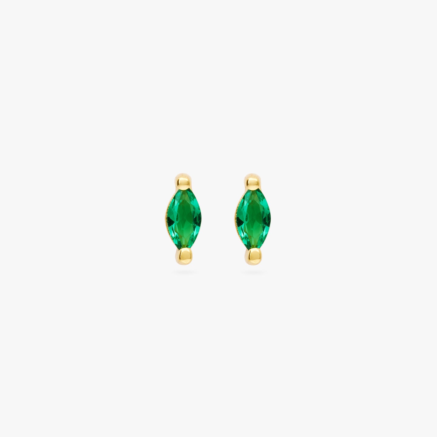 This is a pair of marquise mini studs that feature a green oblong shaped gem and has gold accents [pair] color:null|gold/green