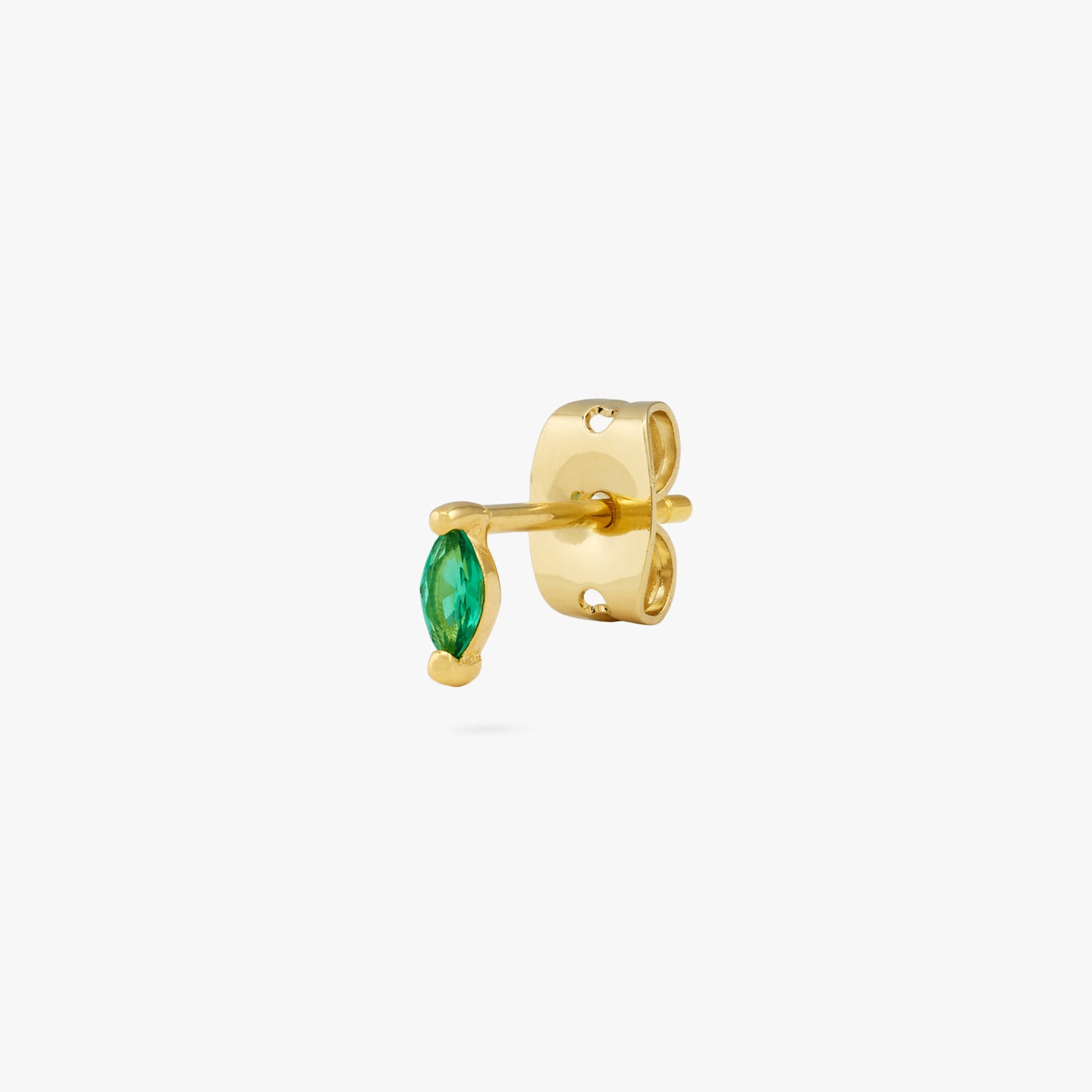 The marquise mini stud features a green oblong shaped gem and has gold accents color:null|gold/green