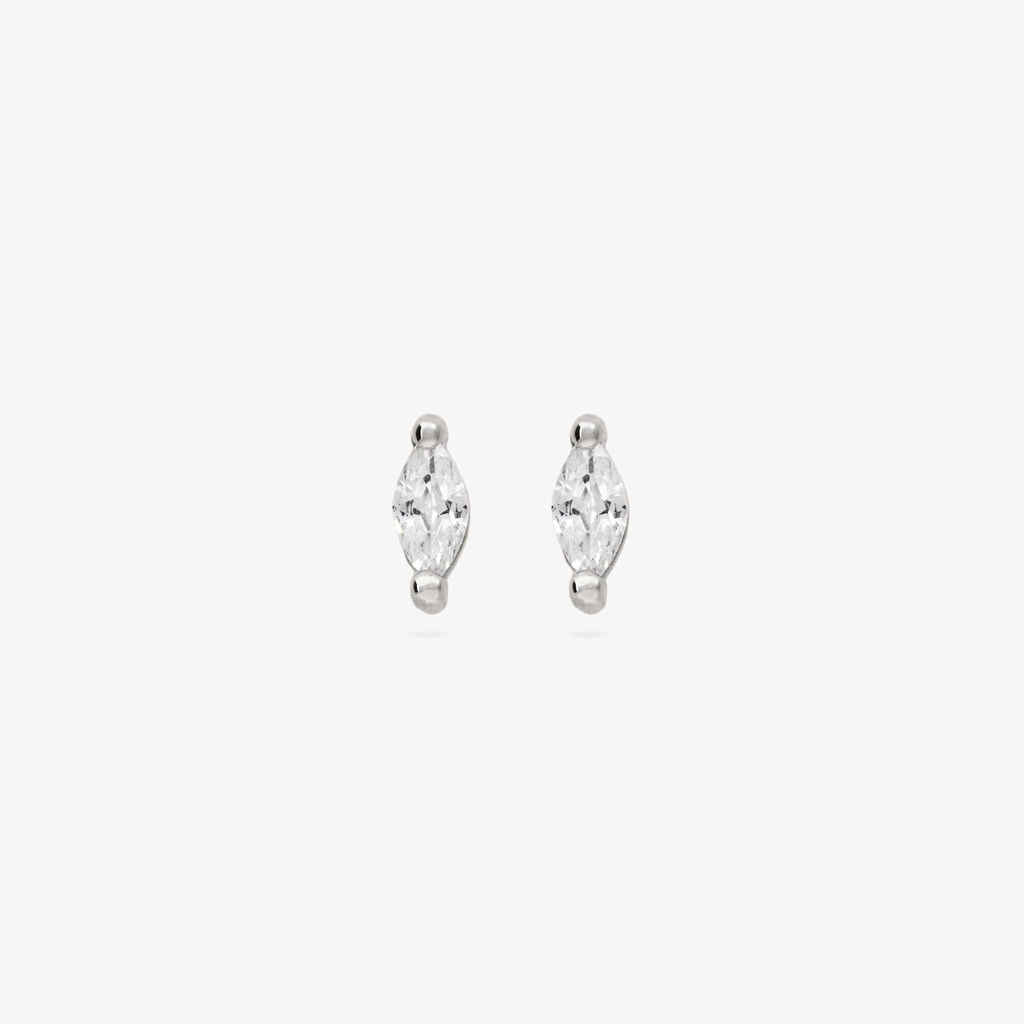 This is a pair of marquise mini studs that feature a clear oblong shaped gem and has silver accents [pair] color:null|silver/clear