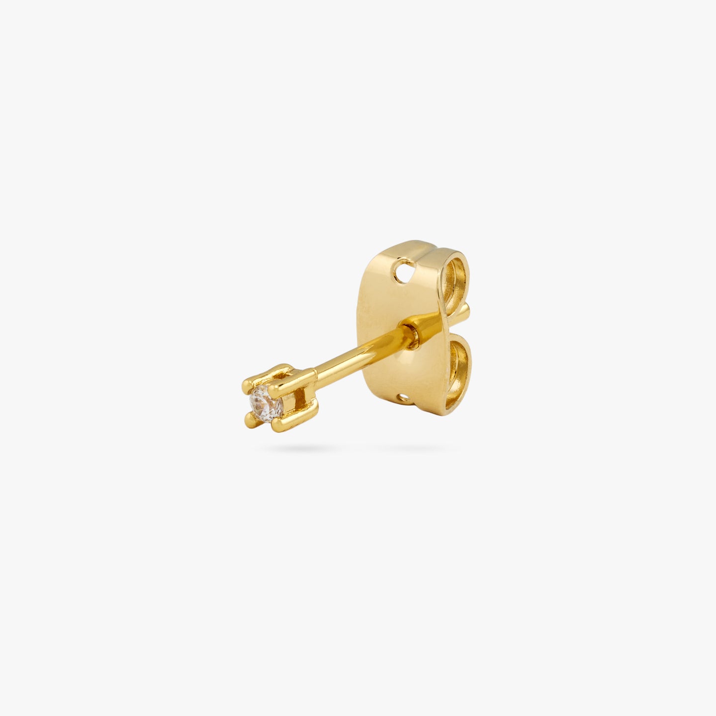A gold micro stud with a clear cz gem color:null|gold/clear