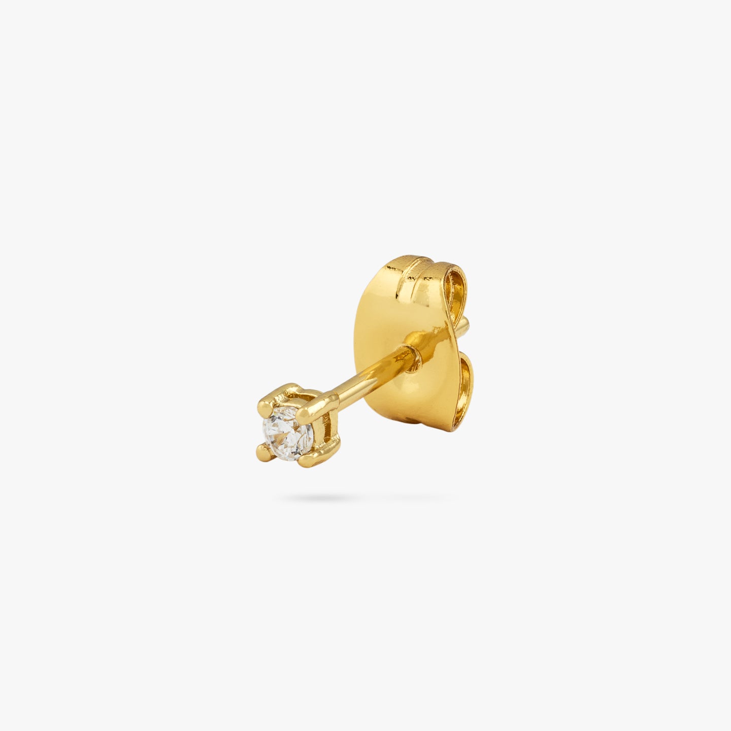 A mini gold stud with a clear cz gem color:null|gold/clear