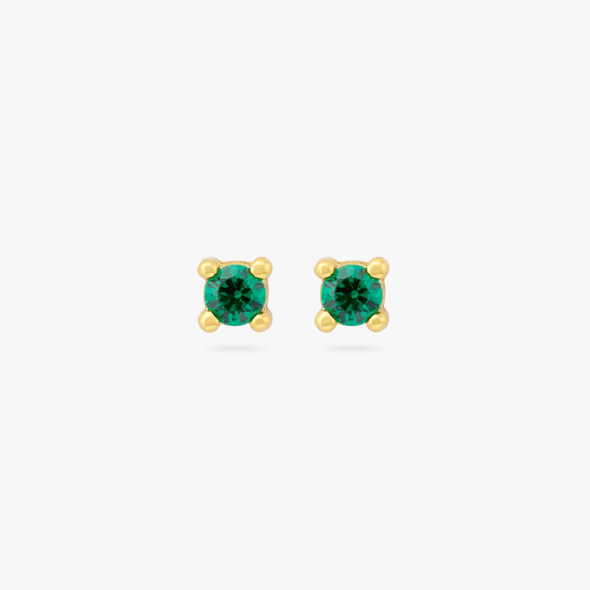 A pair of mini gold studs with a green cz gems [pair] color:null|gold/green