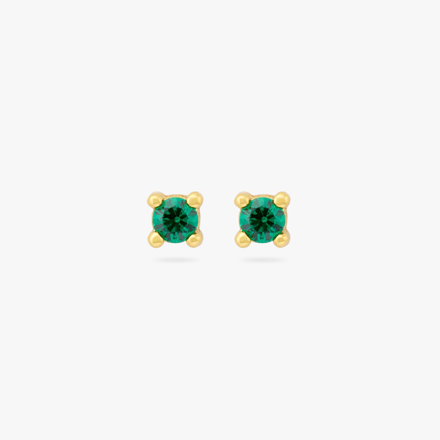 A pair of mini gold studs with a green cz gems [pair] color:null|gold/green