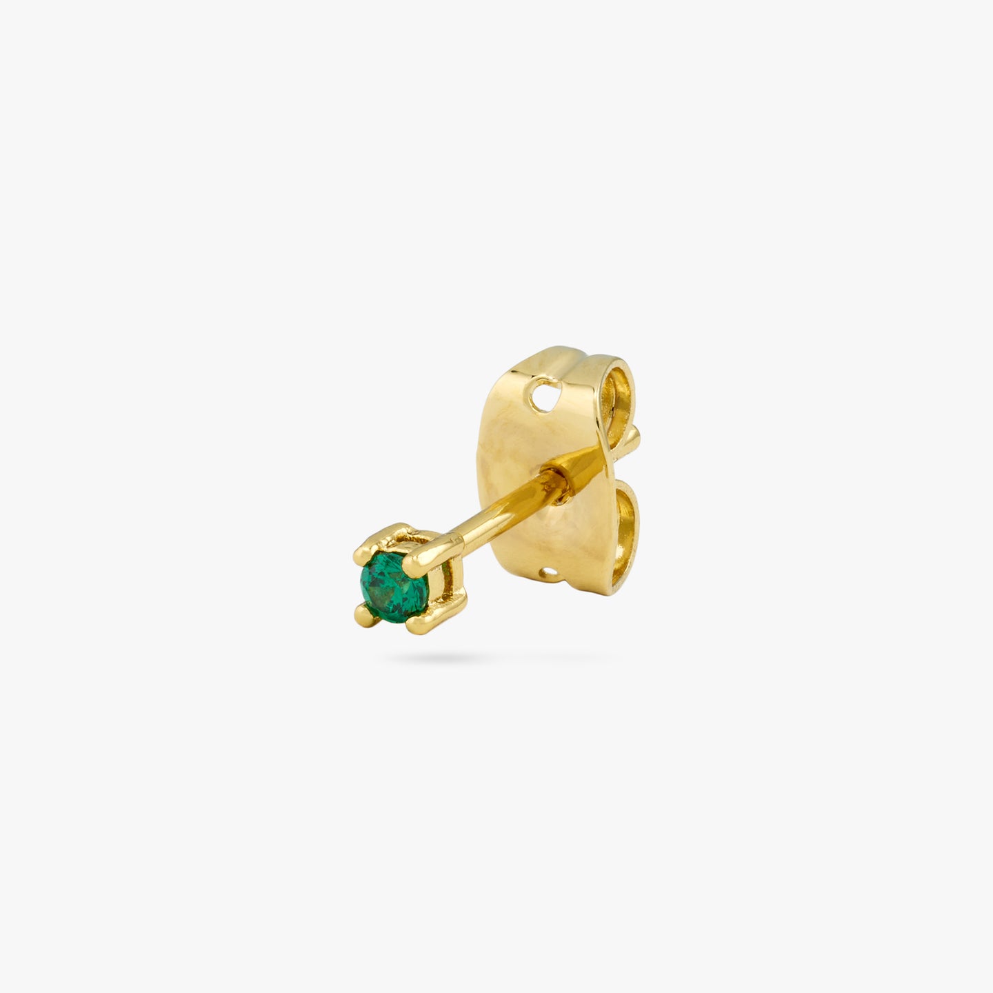 A mini gold stud with a green cz gem color:null|gold/green