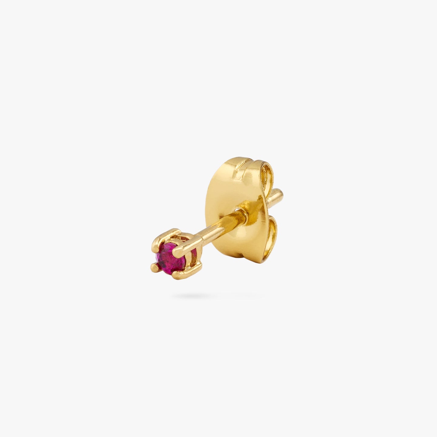 A mini gold stud with a pink cz gem color:null|gold/pink