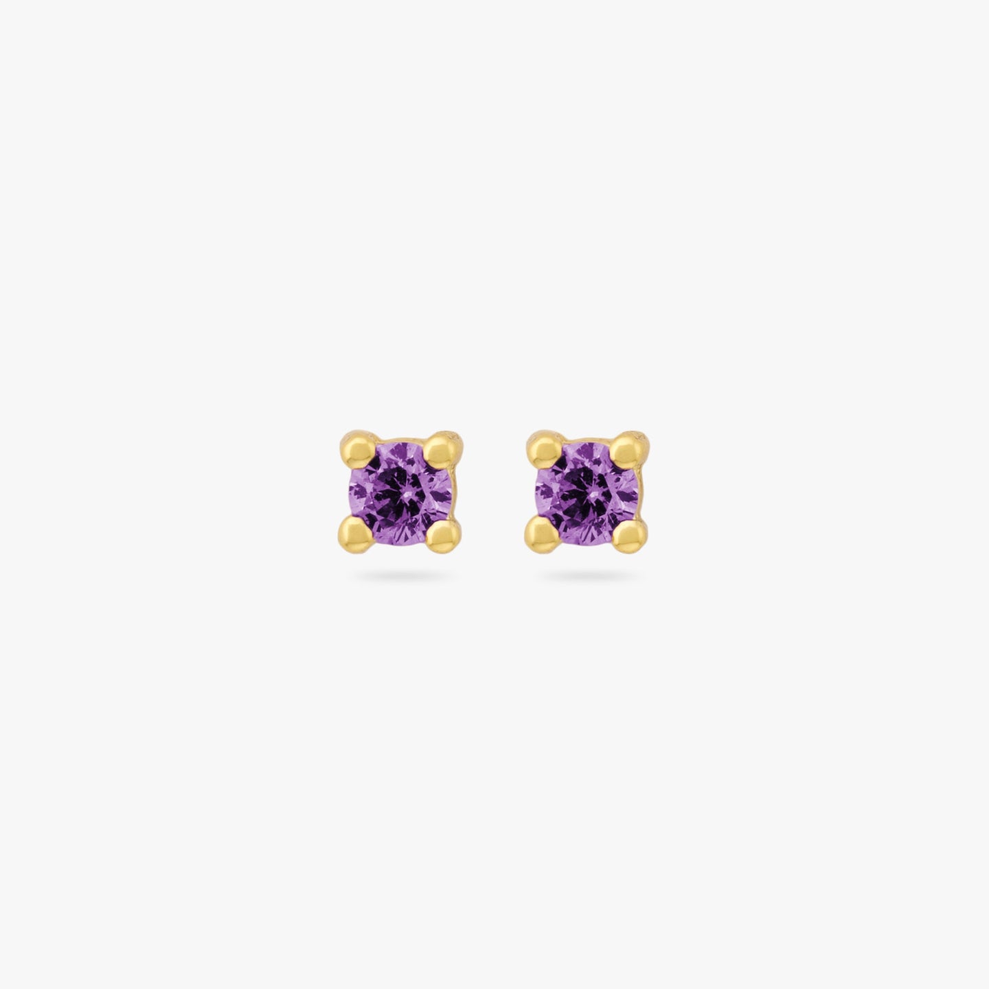 A pair of mini gold studs with purple cz gems color:null|gold/purple