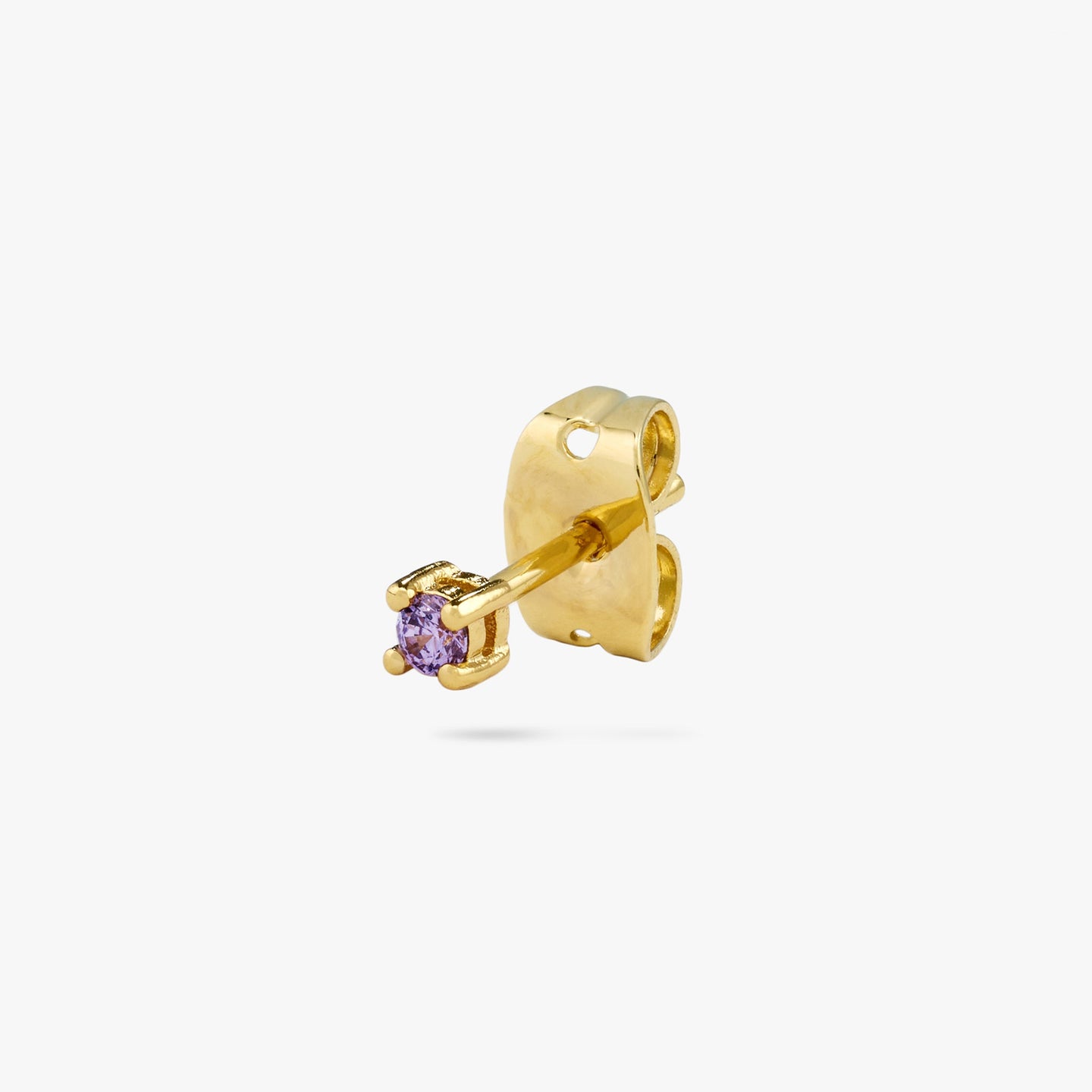 A mini gold stud with a purple cz gem color:null|gold/purple