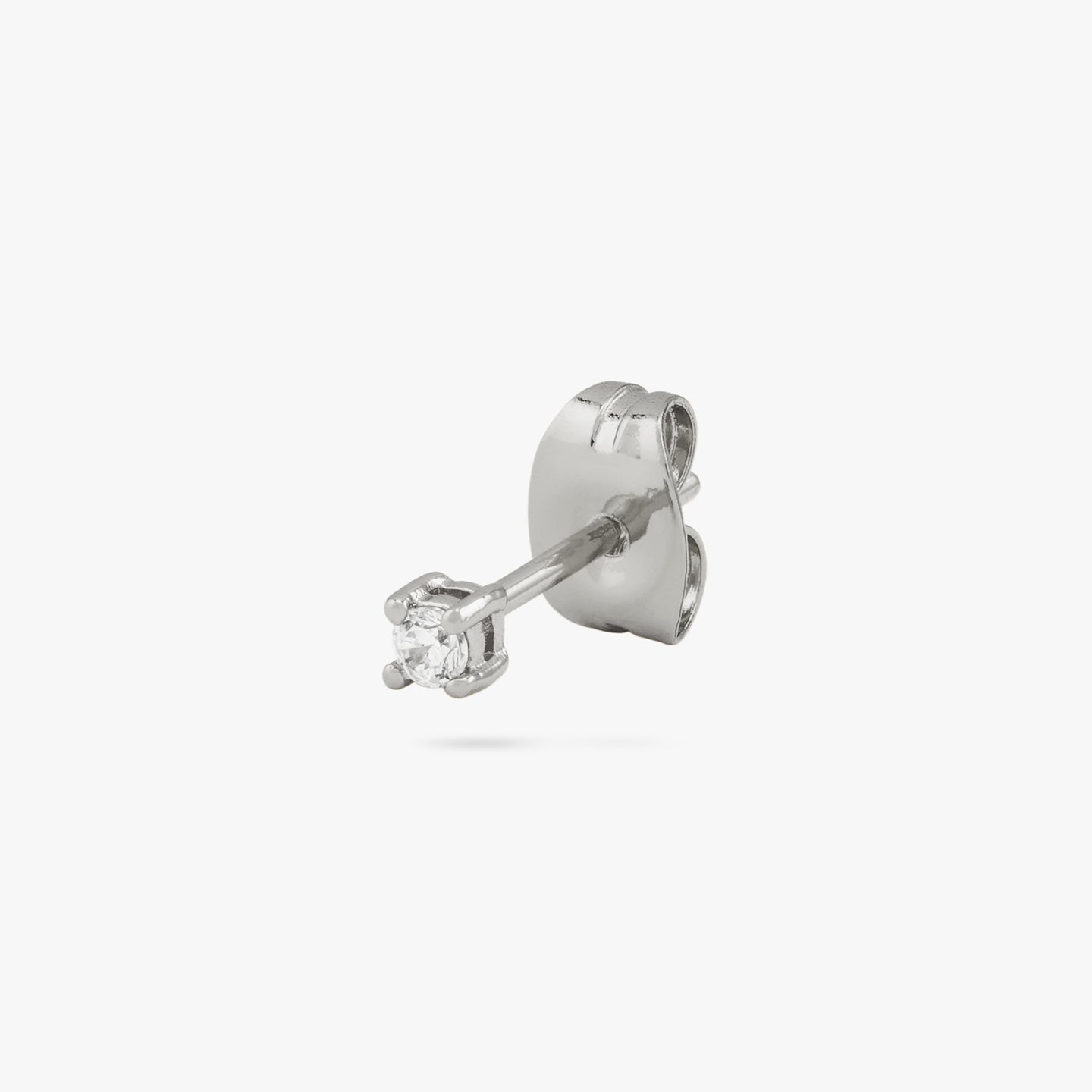 A mini silver stud with a clear cz gem color:null|silver/clear