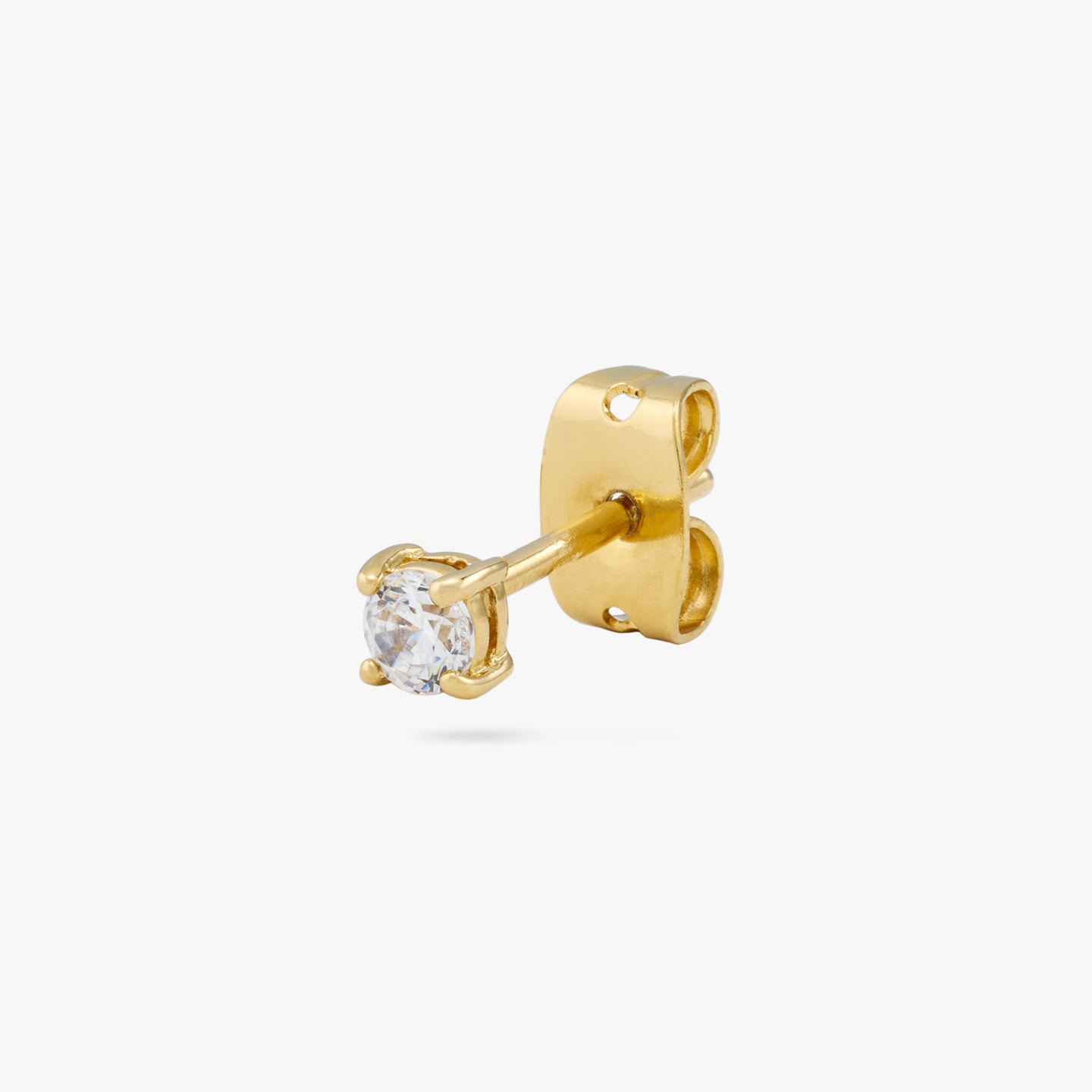 Small CZ stud measuring 3mm. color:null|gold/clear