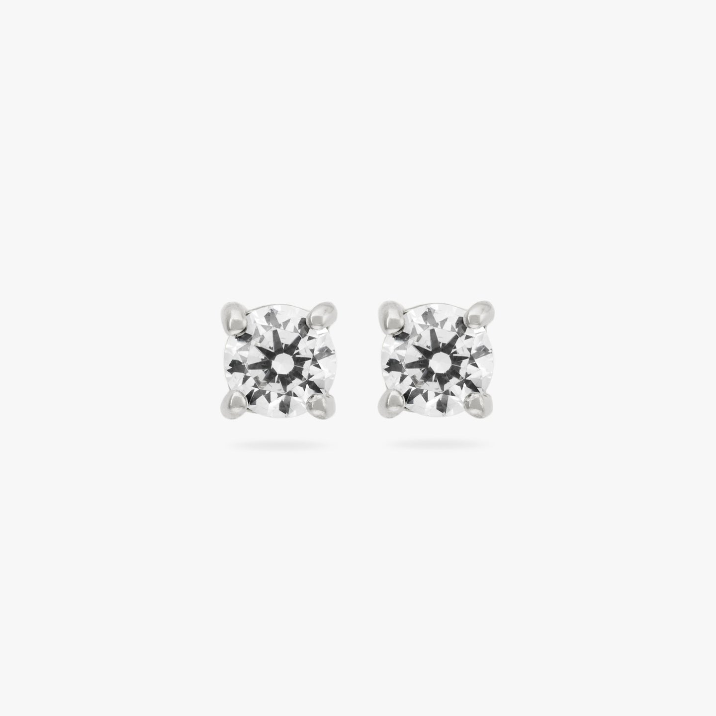 This is a small silver stud with a clear cz accent color:null|silver/clear