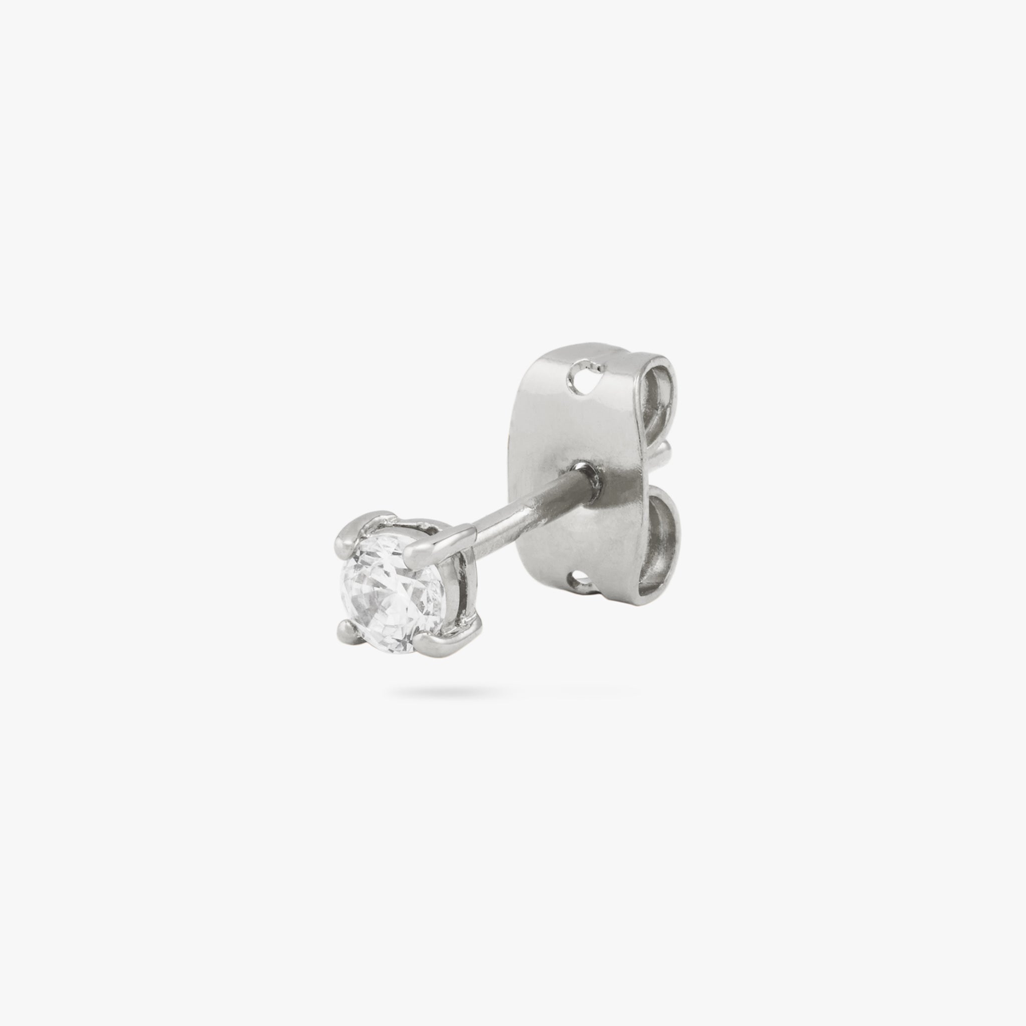 This is a small silver stud with a clear cz accent color:null|silver/clear