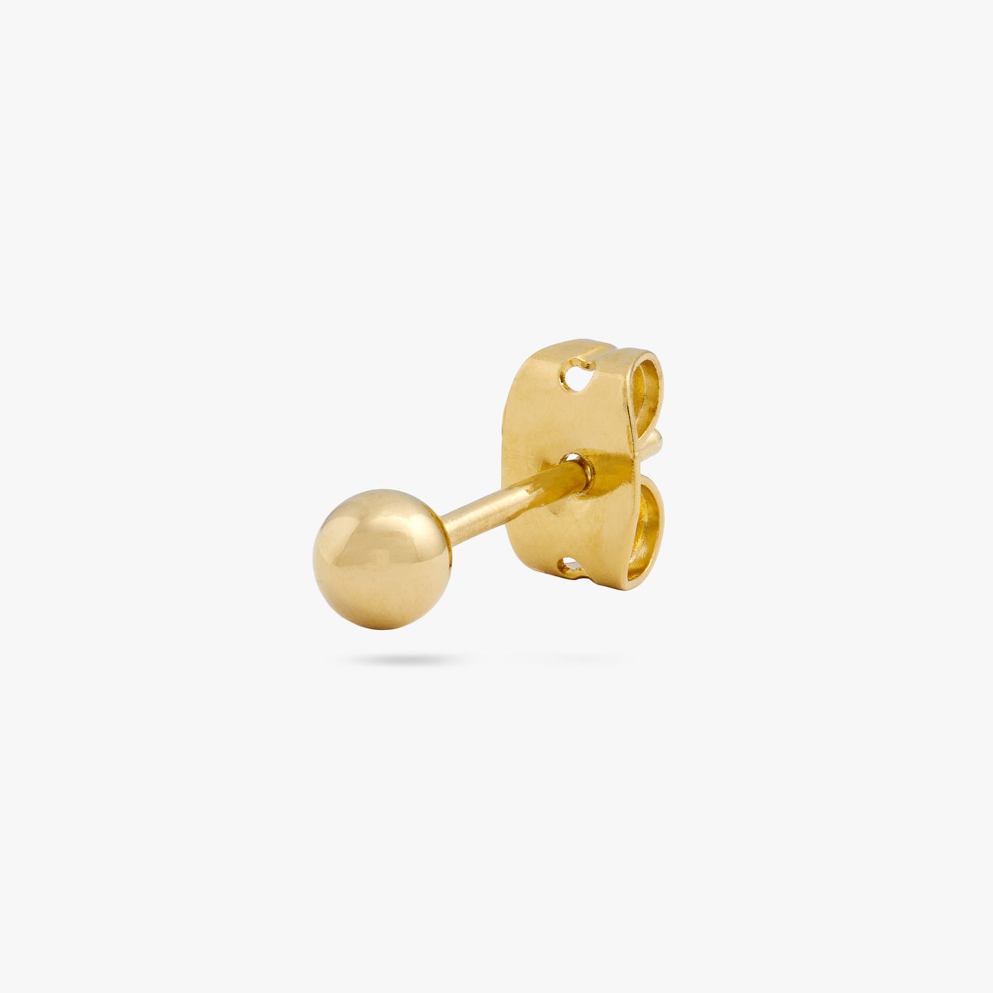 A small gold ball shaped stud color:null|gold