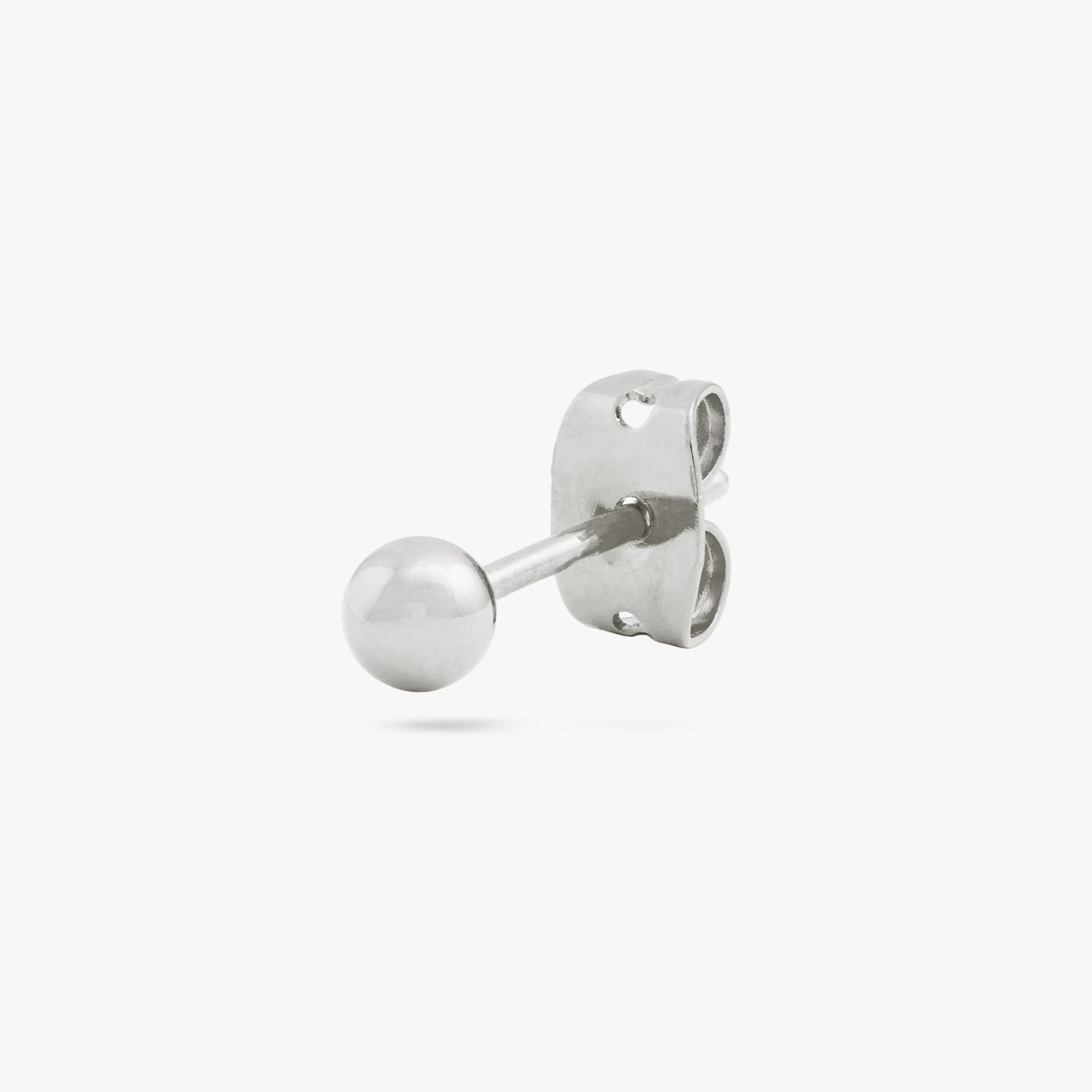 A small silver ball shaped stud color:null|silver