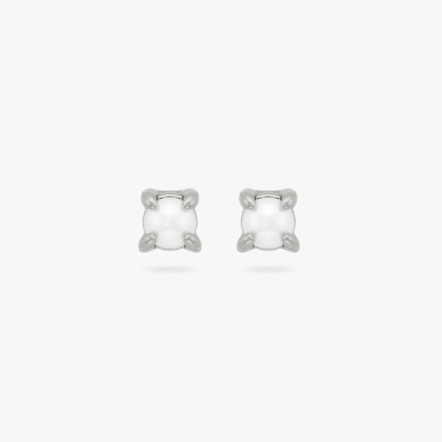 This is a pair of small silver studs with pearl accents [pair] color:null|silver