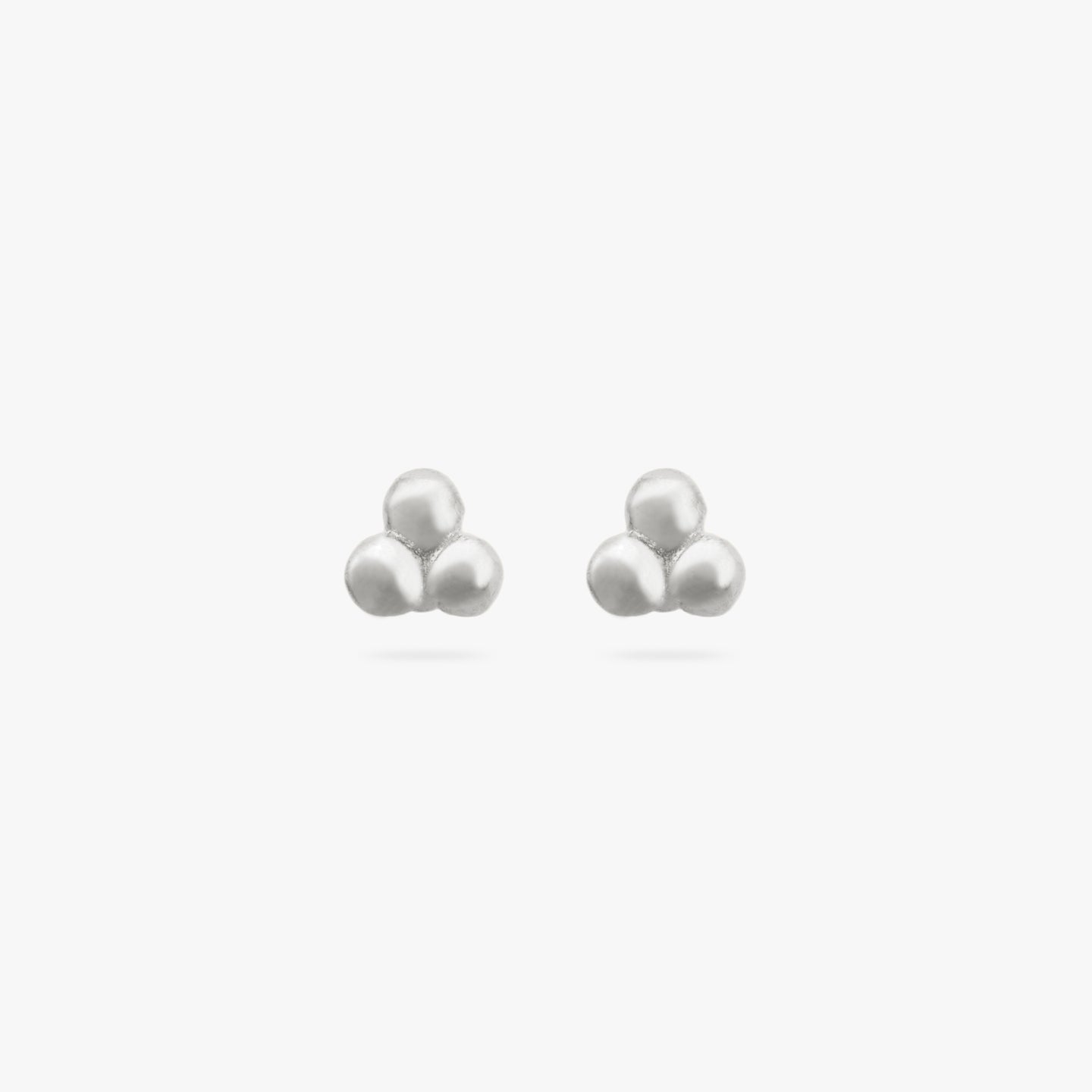 This is a pair of small silver studs of three beads arranged in a cluster [pair] color:null|silver
