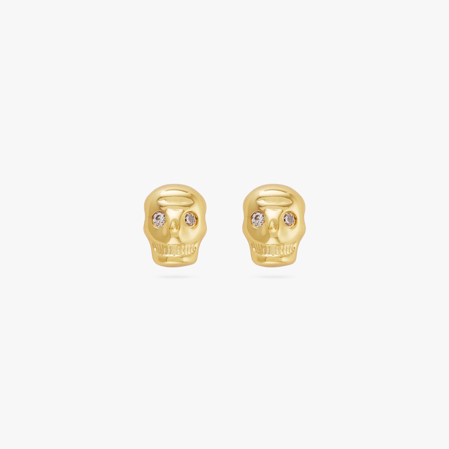 This is a pair of small gold skull studs with cz eyes [pair] color:null|gold
