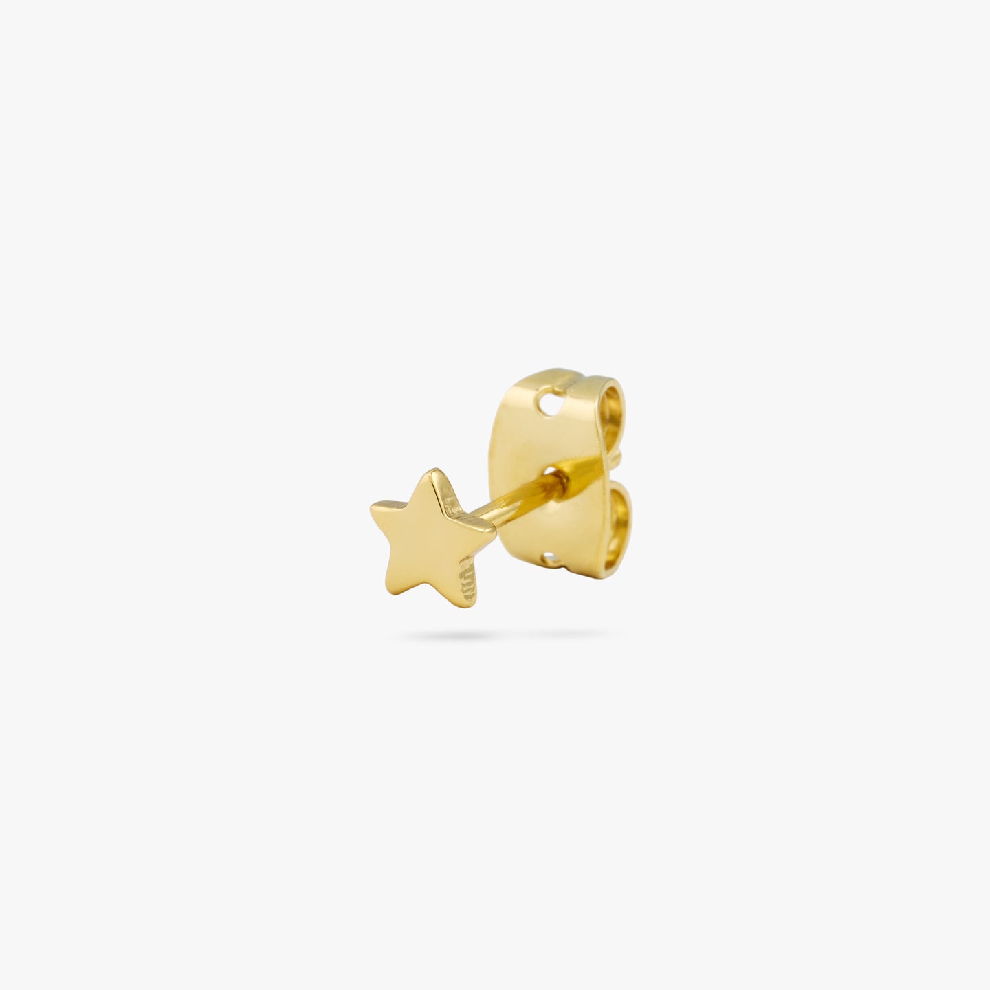 Simple mini gold star stud. color:null|gold