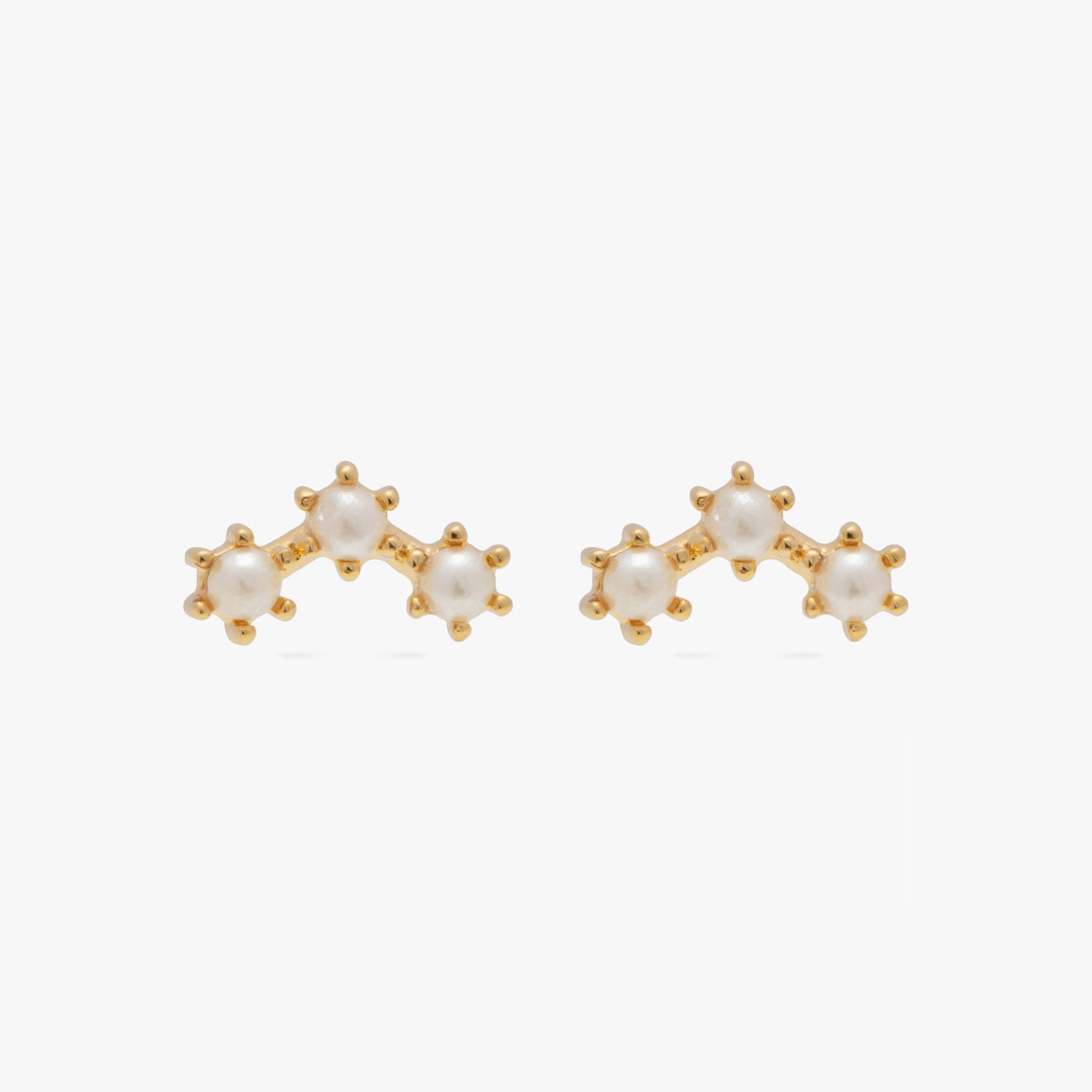 A pair of three pearl studs in an arch shaped cluster [pair] color:null|gold