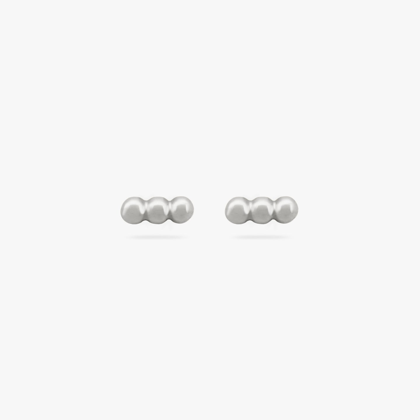 A pair of three silver beads arranged in two bar studs [pair] color:null|silver