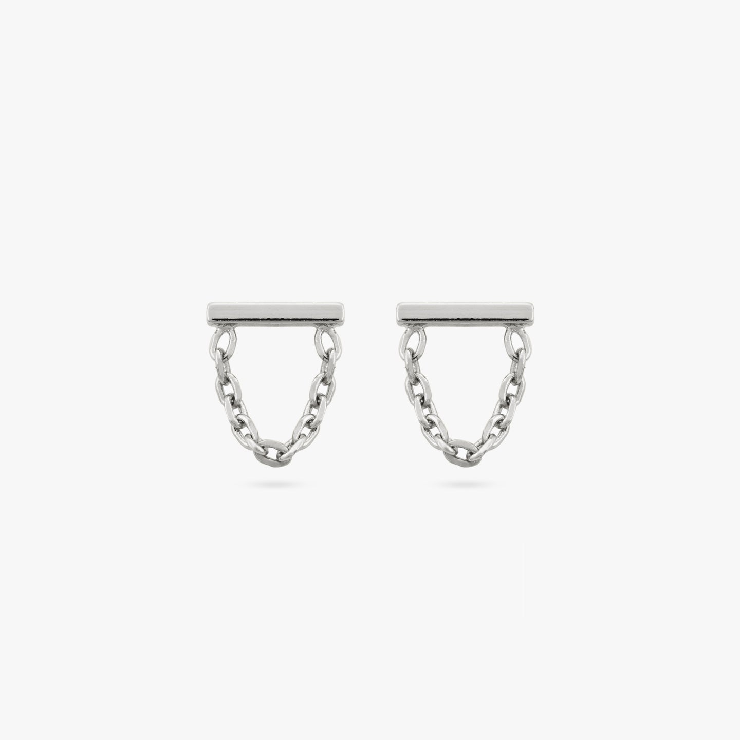 A pair of silver bar studs with chain connecting from end to end. [pair] color:null|silver