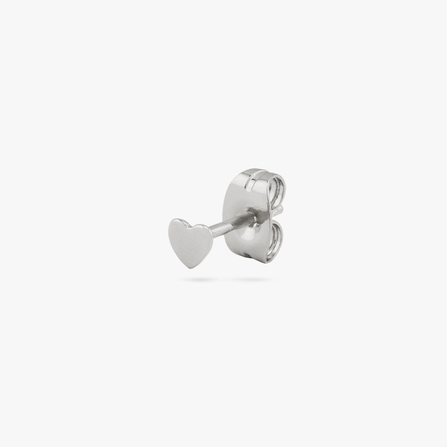 This is a small silver stud in the shape of a heart color:null|silver