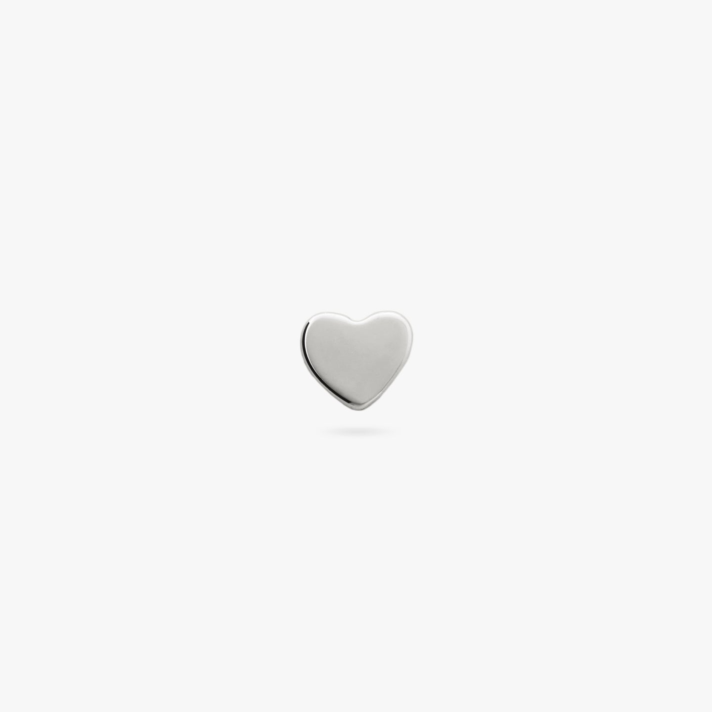 This is a small silver stud in the shape of a heart color:null|silver