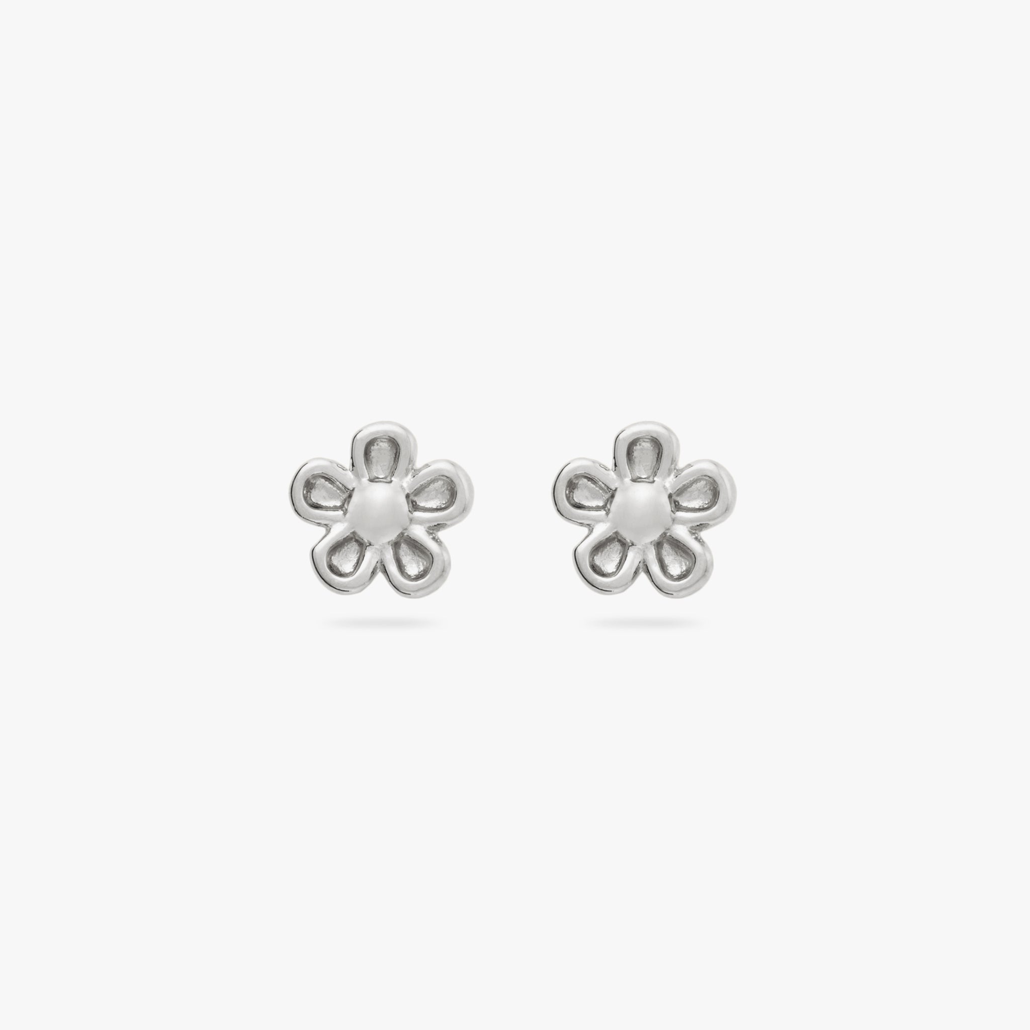 This is a pair of small silver daisy studs [pair] color:null|silver